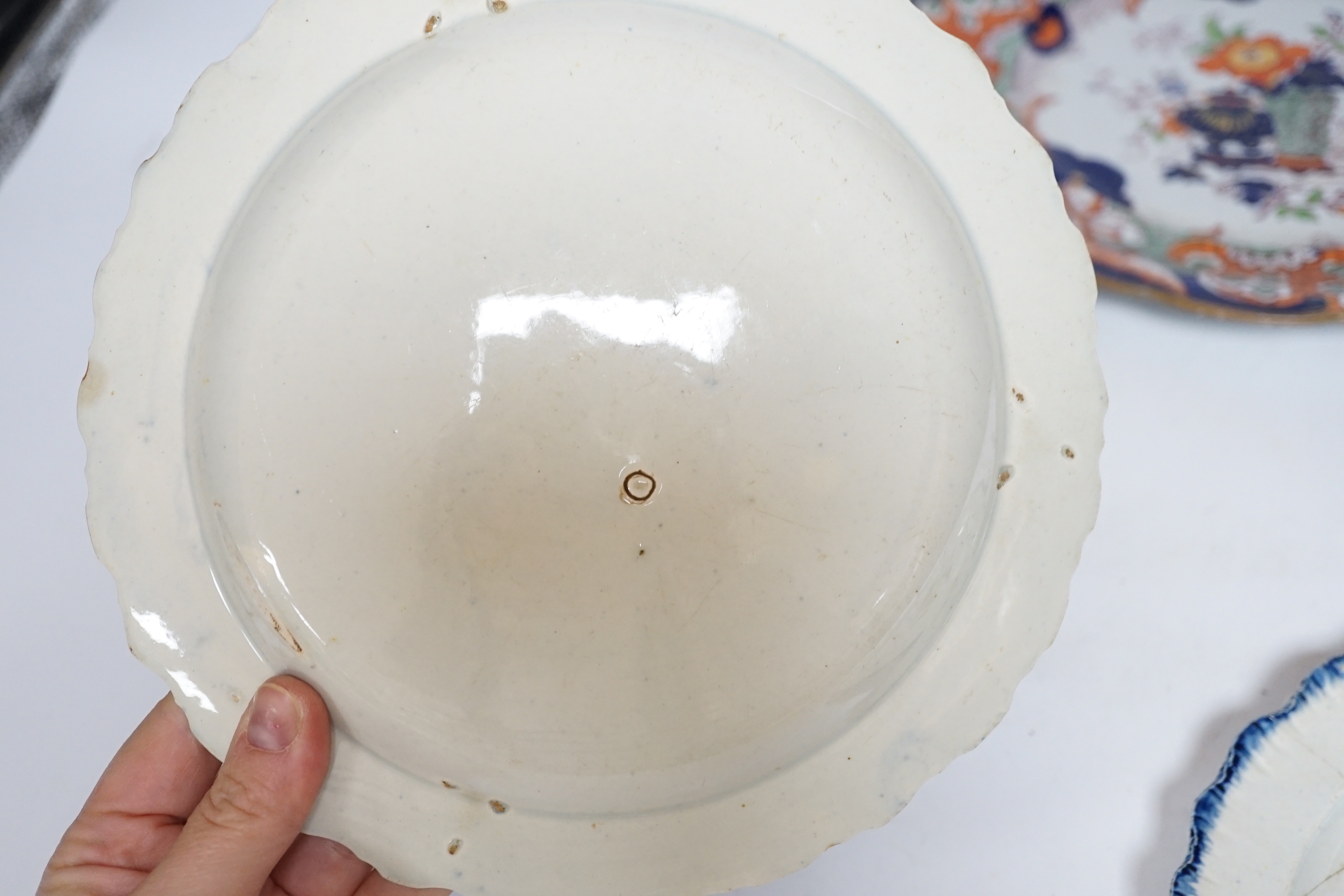 Two late 18th century pearlware Prattware plates, a Chinese export plate and an ironstone plate, largest 27cm in diameter